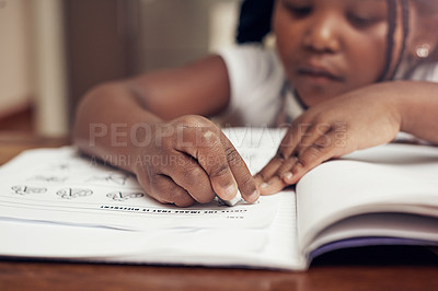 Buy stock photo Cropped shot of an adorable little girl drawing and doing her homework at home