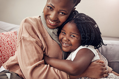 Buy stock photo Hug, portrait or mother and daughter on sofa with love, trust and security in their home together. Black family, face or mom embrace happy girl child in living room with safety, nurture or protection