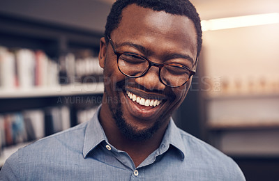 Buy stock photo Cropped portrait of a handsome young male architect smiling while standing in a modern office
