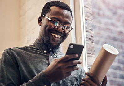 Buy stock photo Black man, happy and phone with blueprint in office for building plan, research and communication. Employee, smile and contractor with tech at work for architecture, online news and update to client