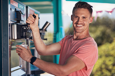 Buy stock photo Portrait of a cheerful young coffee barista pouring a cup of coffee to serve to a customer outside next to his coffee truck