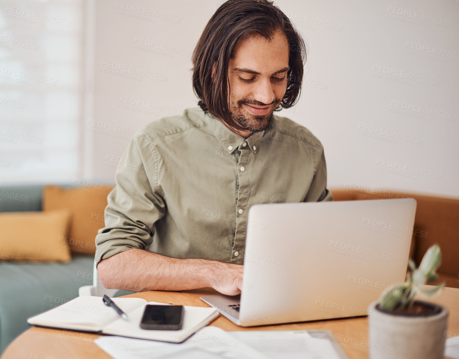 Buy stock photo Creative, laptop and smile with web developer man in office of small business for design. Notebook, phone and typing with happy employee at desk in workplace as online illustrator or publisher