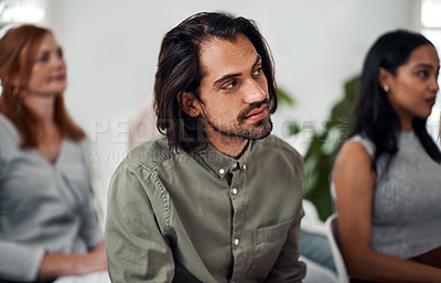 Buy stock photo Shot of a young businessman attending a conference