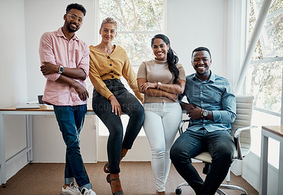Buy stock photo Cropped portrait of a diverse group businesspeople sitting together after a successful discussion in the office