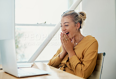 Buy stock photo Cropped shot of an attractive young businesswoman sitting and alone celebrating while using her laptop in the office
