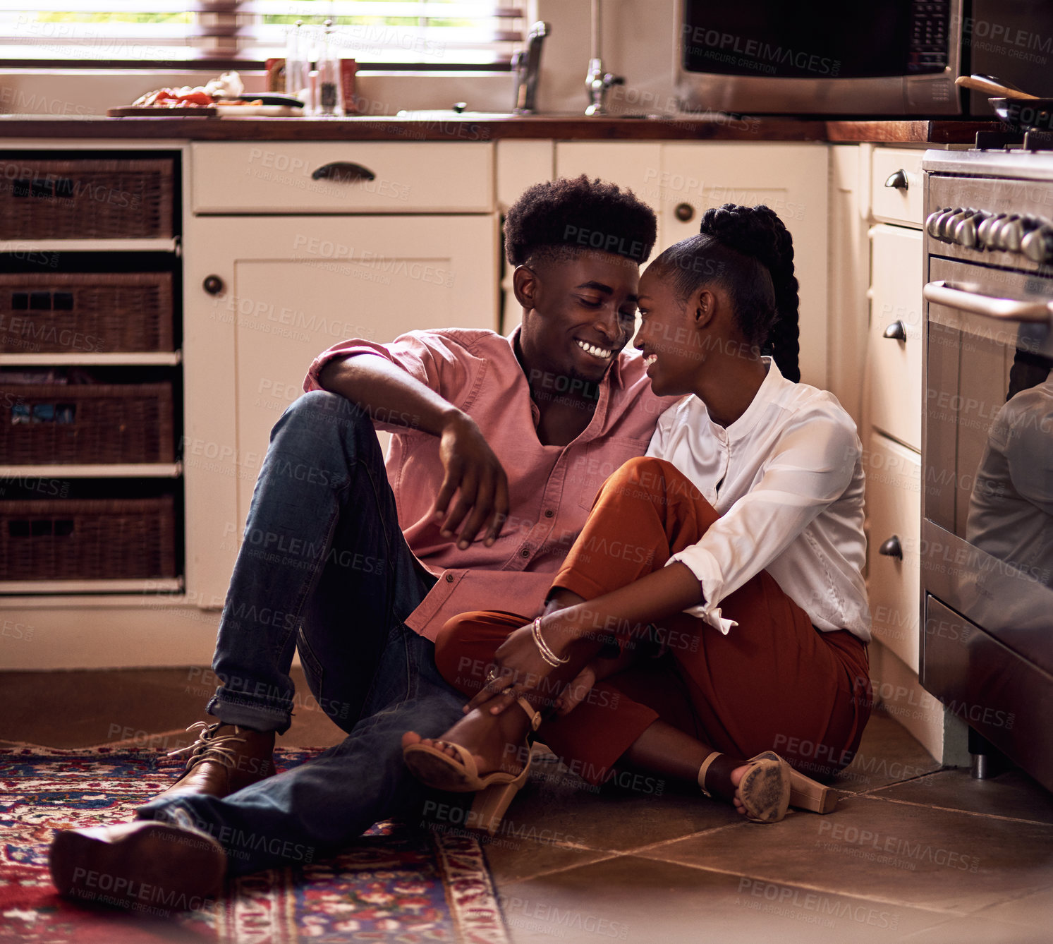 Buy stock photo Black couple, kitchen floor and happy people in home, love and caring in romance relationship with trust in house. Bonding, commitment and smiling for connection, partner and relax in apartment