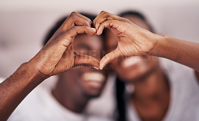 Buy stock photo Black couple, happy and heart hands in home for love, romantic gesture or symbol of emotional connection. Emoji, shape and closeup of sign for affection on valentines day, relationship and commitment