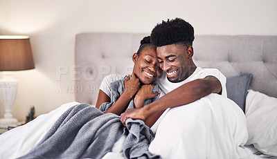 Buy stock photo Shot of an affectionate couple spending quality time in their bedroom