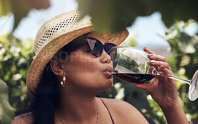 Buy stock photo Cropped shot of a beautiful young woman having a glass of wine outdoors