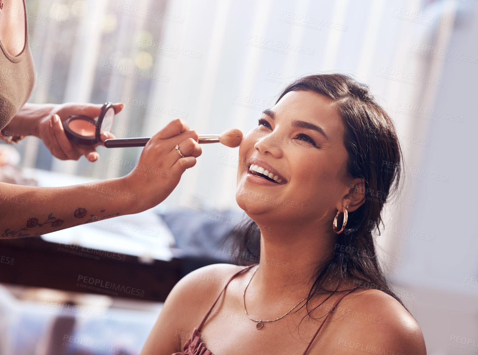 Buy stock photo Cropped shot of a beautiful young woman getting her makeup done