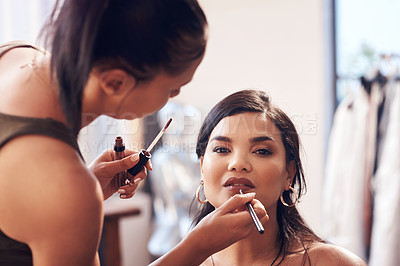 Buy stock photo Cropped shot of a beautiful young woman getting her makeup done