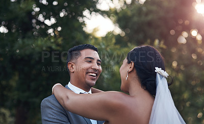 Buy stock photo Cropped shot of an affectionate couple standing outside on their wedding day