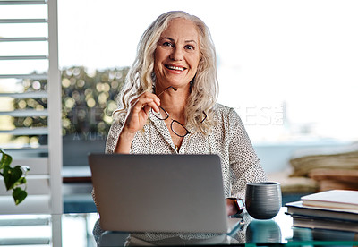 Buy stock photo Cropped portrait of an attractive senior businesswoman smiling while working from home