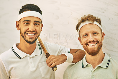 Buy stock photo Shot of two confident young men standing together at a squash court
