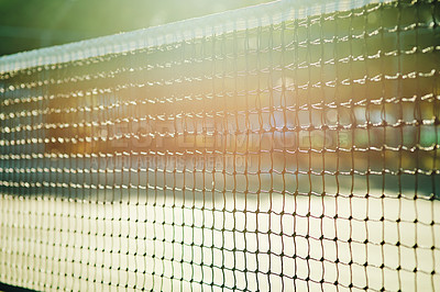 Buy stock photo Closeup shot of a tennis net on a tennis court