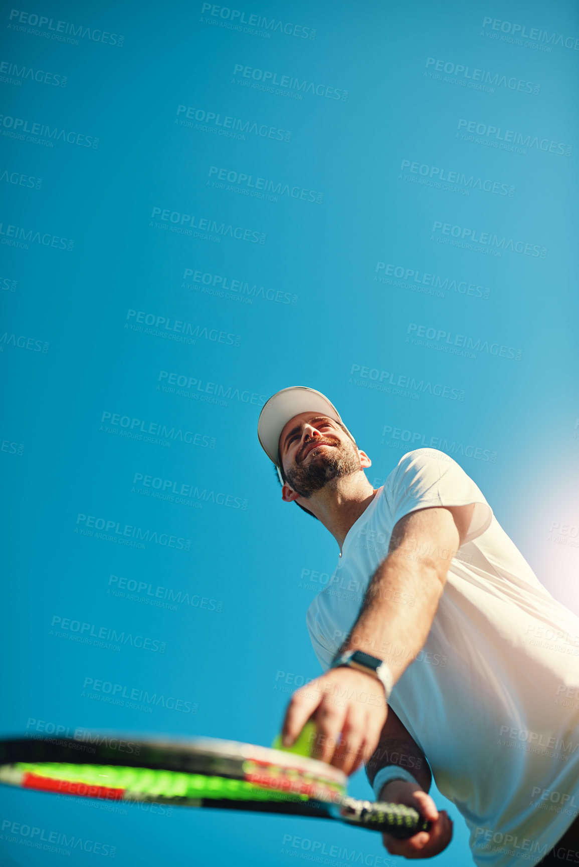 Buy stock photo Happy man, tennis and racket with ball for serve, game or match start below blue sky background. Young, male person or athlete with smile for playing sport, competition or tournament on mockup space