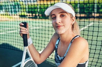 Buy stock photo Portrait of a sporty young woman sitting on a tennis court