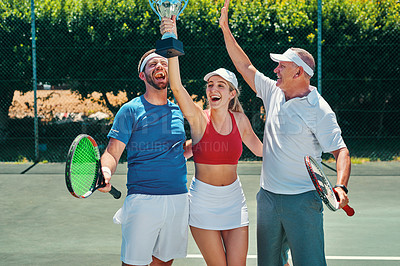 Buy stock photo Cropped shot of a group of sportspeople celebrating a win after winning a trophy in a tennis match