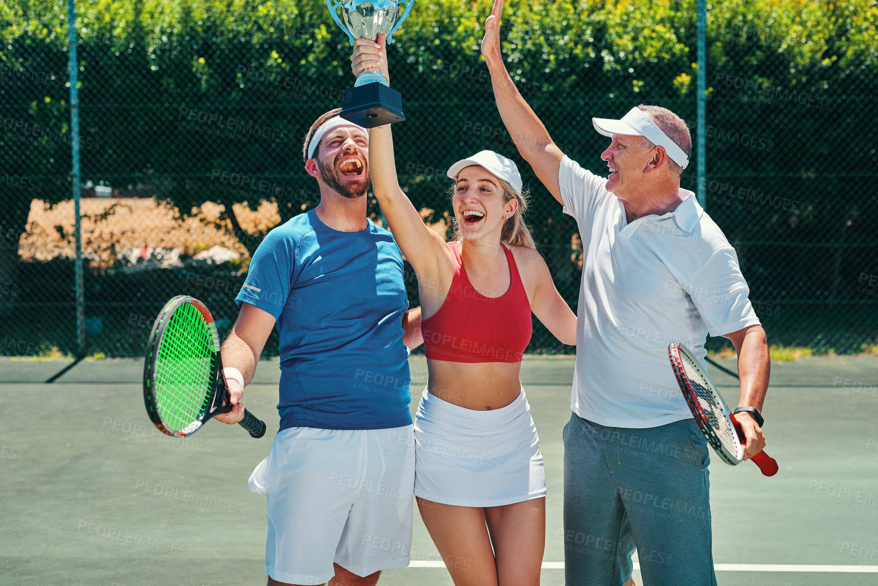 Buy stock photo Tennis court, celebrate and team with trophy, winning and success in contest or sport challenge. People, happiness and athlete for game, match or tournament in competition, training or activity in UK