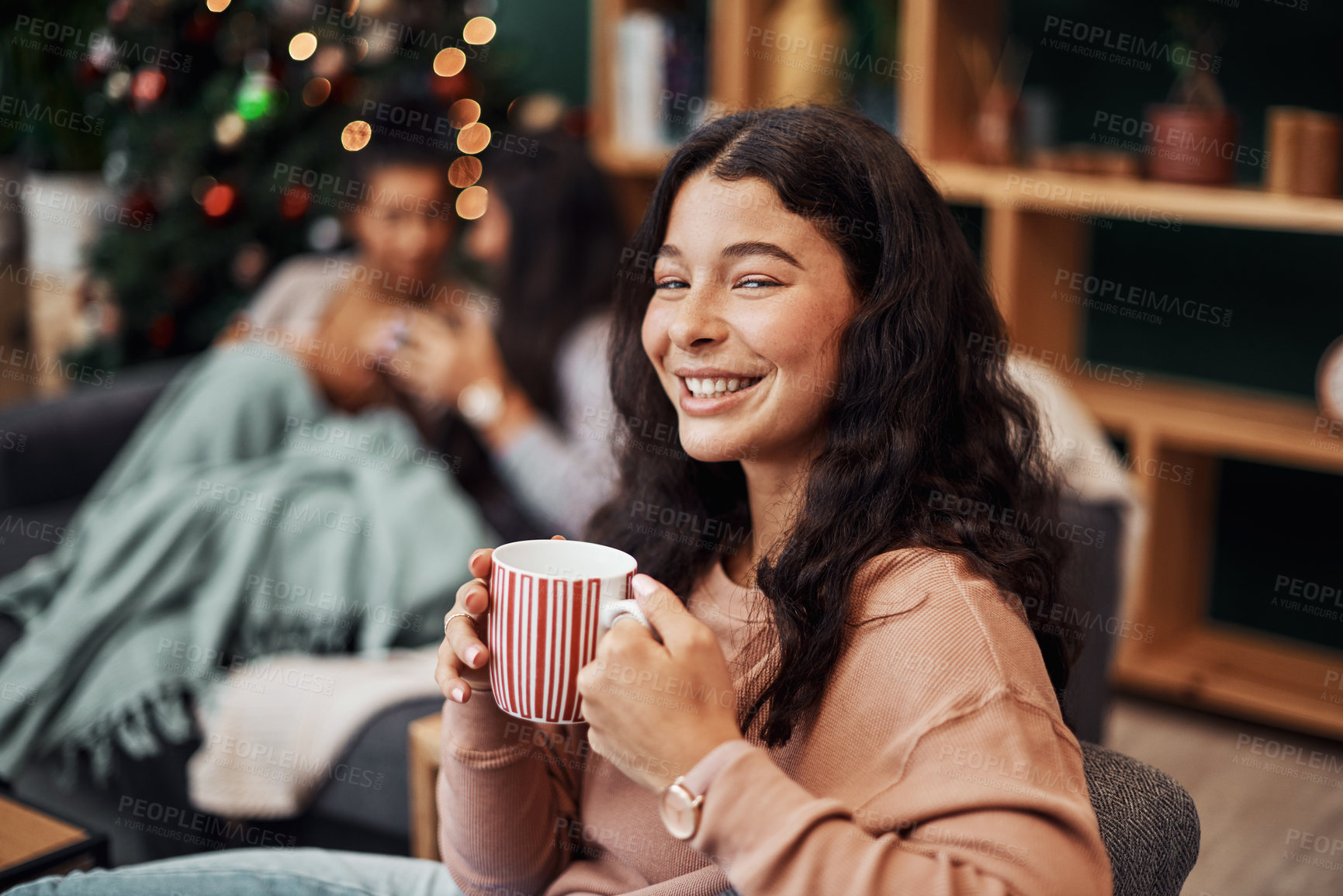 Buy stock photo Portrait, teen and happy girl on sofa with coffee, beverage and hot chocolate to relax on Christmas holiday. Lounge, friendship and female person with festive spirit, joy and mug for drink at home