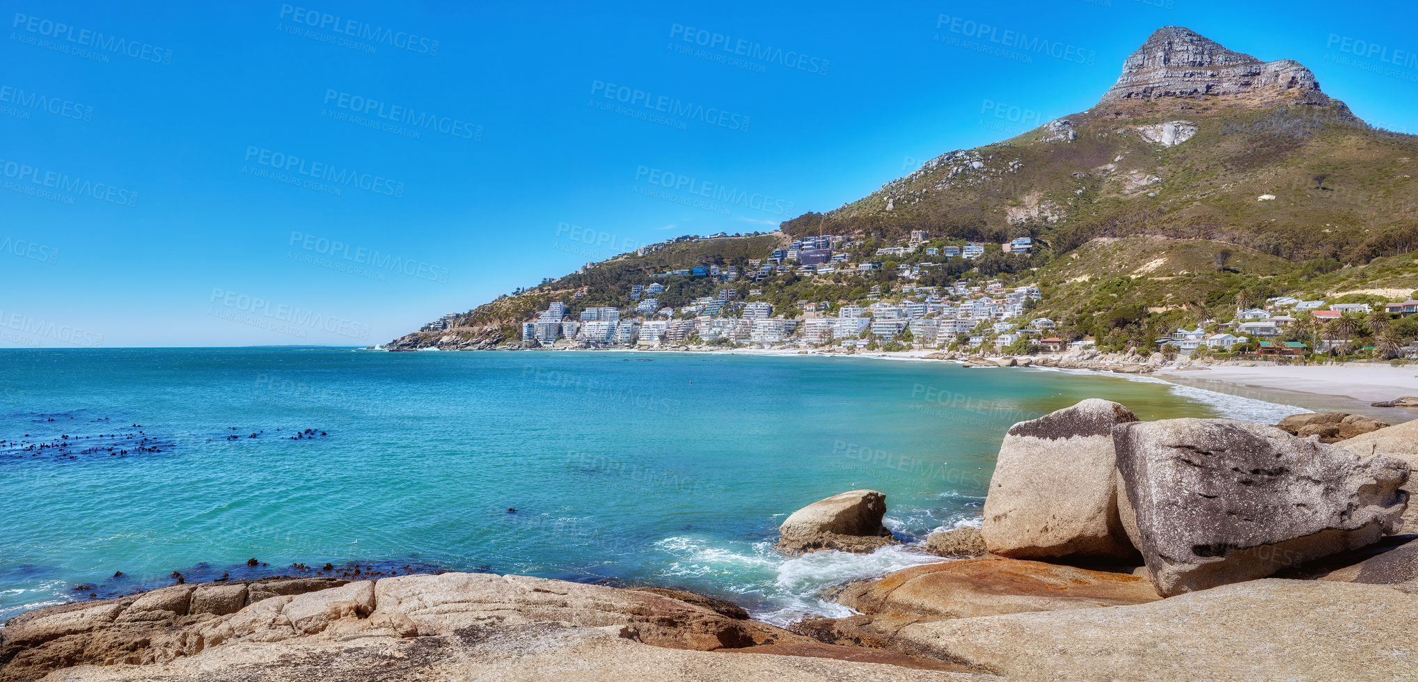 Buy stock photo A mountain near a calm beach in South Africa. Scenic nature landscape of Lions Head near a peaceful sea on a sunny day with copy space in Cape Town. Exotic location for summer vacation and travel