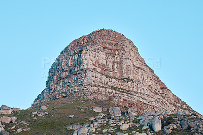 Buy stock photo Landscape view of Lion's Head and surroundings on a sunny day. Scenery of the peak of a mountain against a clear blue sky in a tourist town. Popular and attractive natural landmark in Cape Town