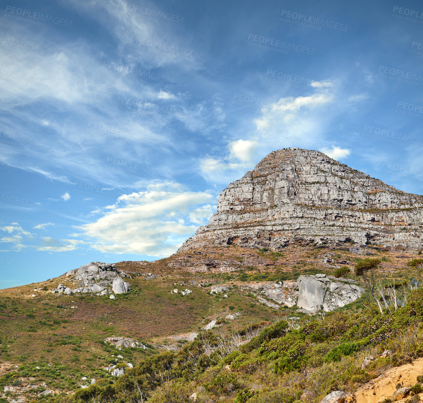 Buy stock photo Landscape view of Lions Head mountain with clouds covering the peak against a blue sky and copy space in Cape Town, South Africa. Wild, rough hiking terrain in popular tourism destination and nature