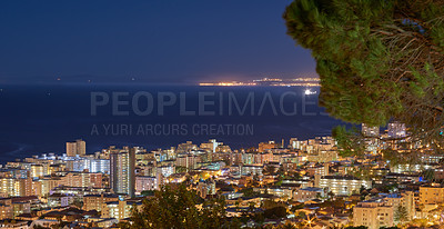 Buy stock photo City lights of Cape Town at sunset from above with copy space. Panoramic coastal urban landscape at night. High angle view from Signal Hill, South Africa of the cityscape and a beautiful horizon