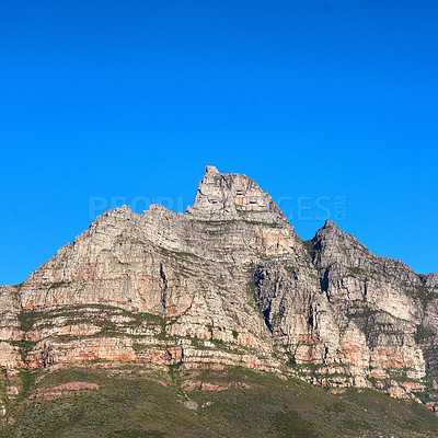 Buy stock photo A scenic landscape view of Table Mountain in Cape Town, South Africa against a blue sky background from below. A panoramic view of an iconic landmark and famous travel destination with copyspace