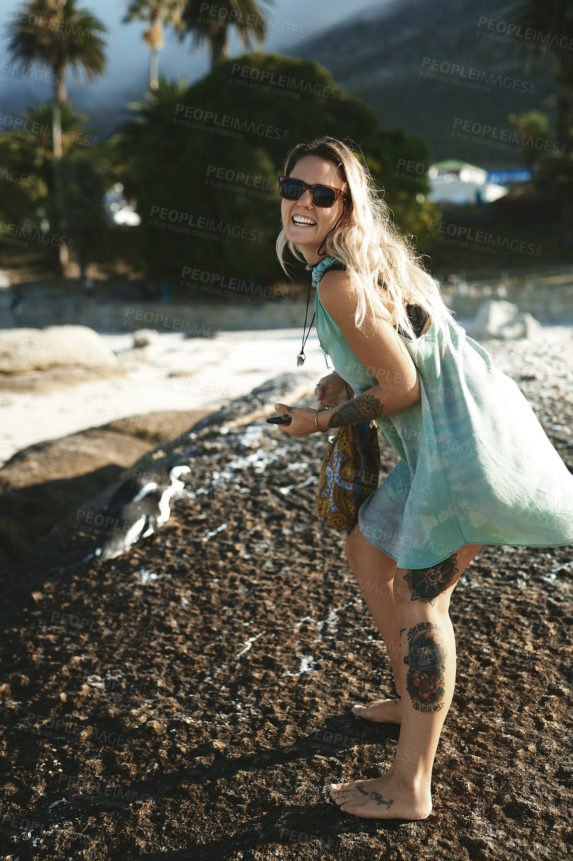 Buy stock photo Full length portrait of an attractive young woman standing on the beach alone during a day outdoors