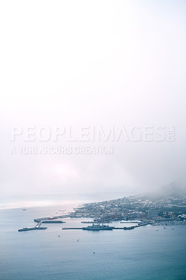 Buy stock photo Cropped shot of a busy coastal village on a mountain side during the day
