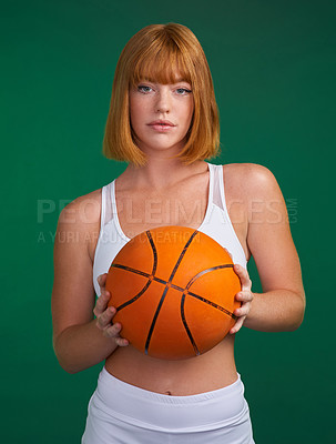 Buy stock photo Portrait, fitness and woman with basketball in studio for sports workout, game challenge and cardio exercise. Female athlete, ball and physical training for competition, activity and green background