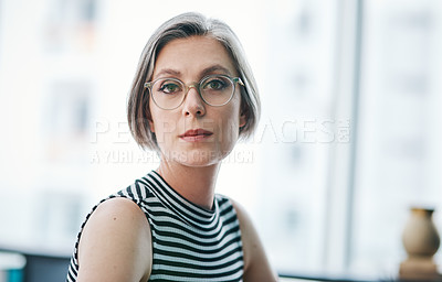 Buy stock photo Cropped shot of a mature businesswoman in her office