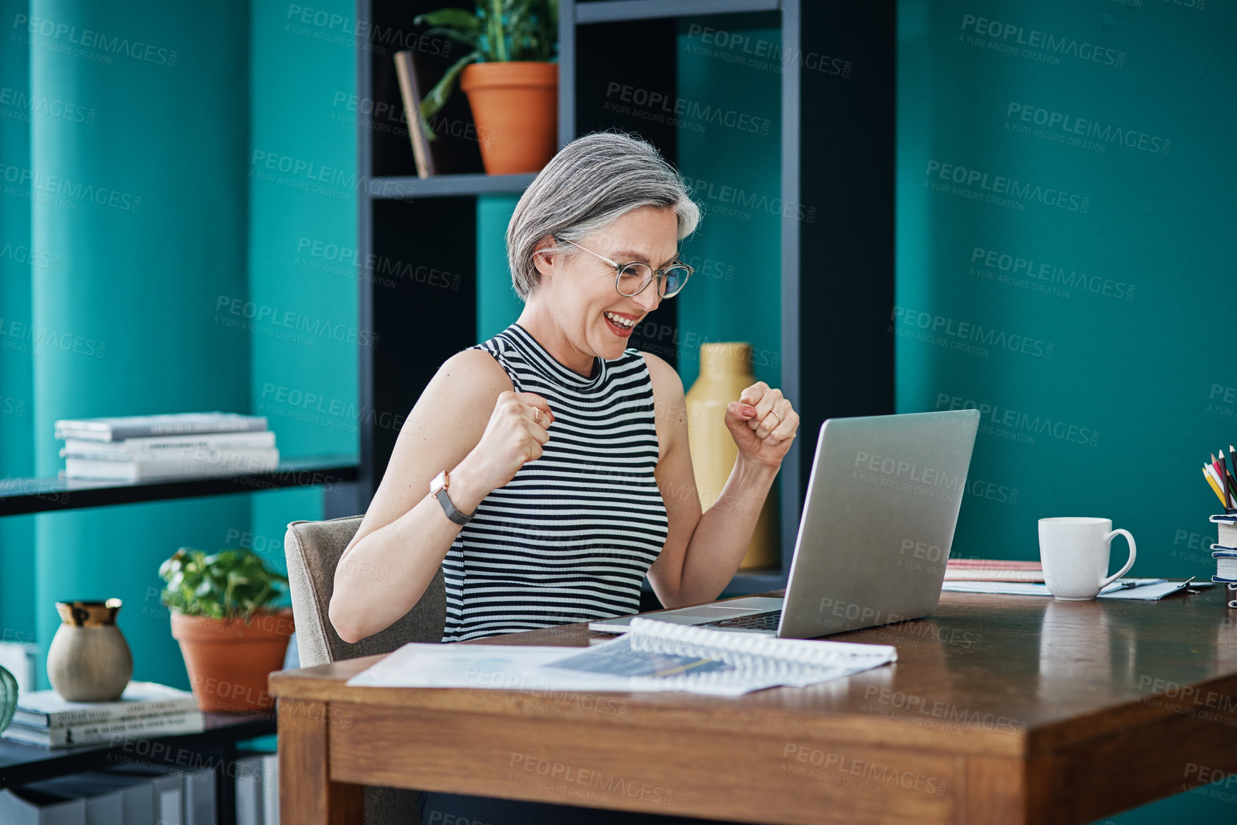 Buy stock photo Shot of a businesswoman looking cheerful while using her laptop