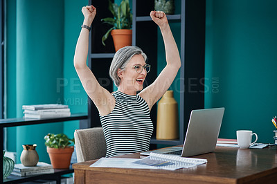 Buy stock photo Shot of a businesswoman looking cheerful while using her laptop