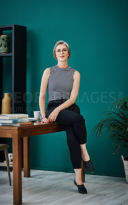 Buy stock photo Shot of a mature businesswoman in a modern office