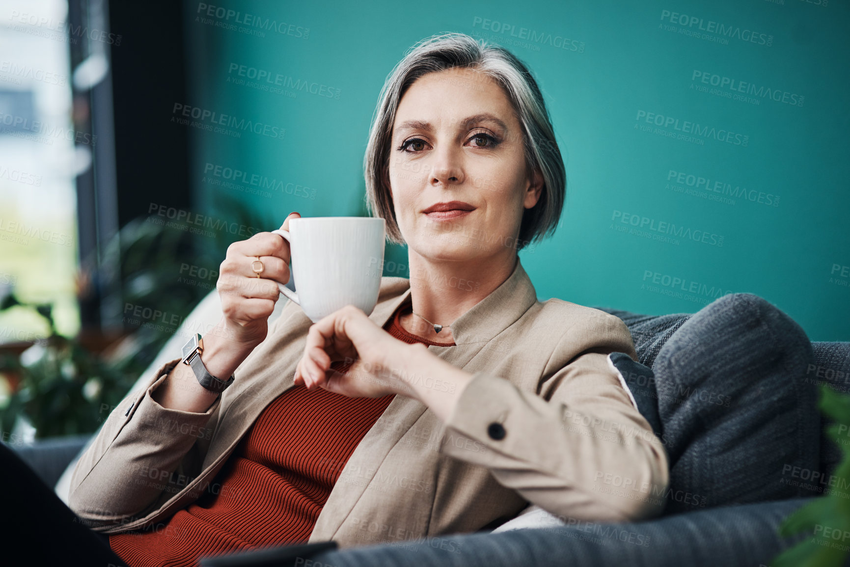 Buy stock photo Break, coffee and portrait with business woman on sofa in office to relax or rest as professional person. Confident, empowerment and gray hair with mature manager drinking beverage in workplace