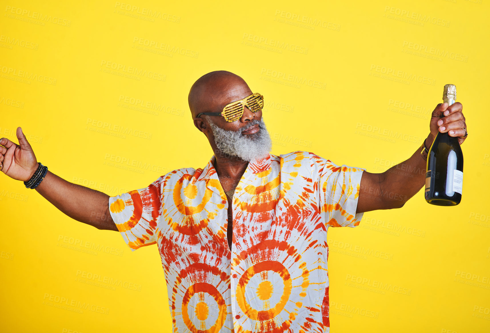 Buy stock photo Mature man, champagne and celebration on studio background for birthday party, happiness and festival. Black person, alcohol and cool sunglasses for holiday, event and New Year concert with relax