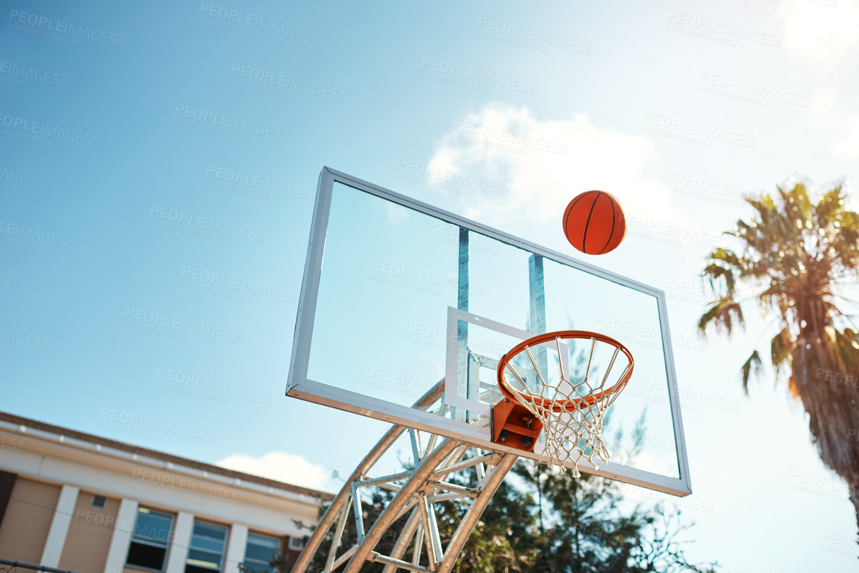 Buy stock photo Above, basketball court and wellness with fitness, training and practice for game, cardio and hobby. Outdoor, blue sky and playing with recreation, exercise and workout with energy, empty and Miami