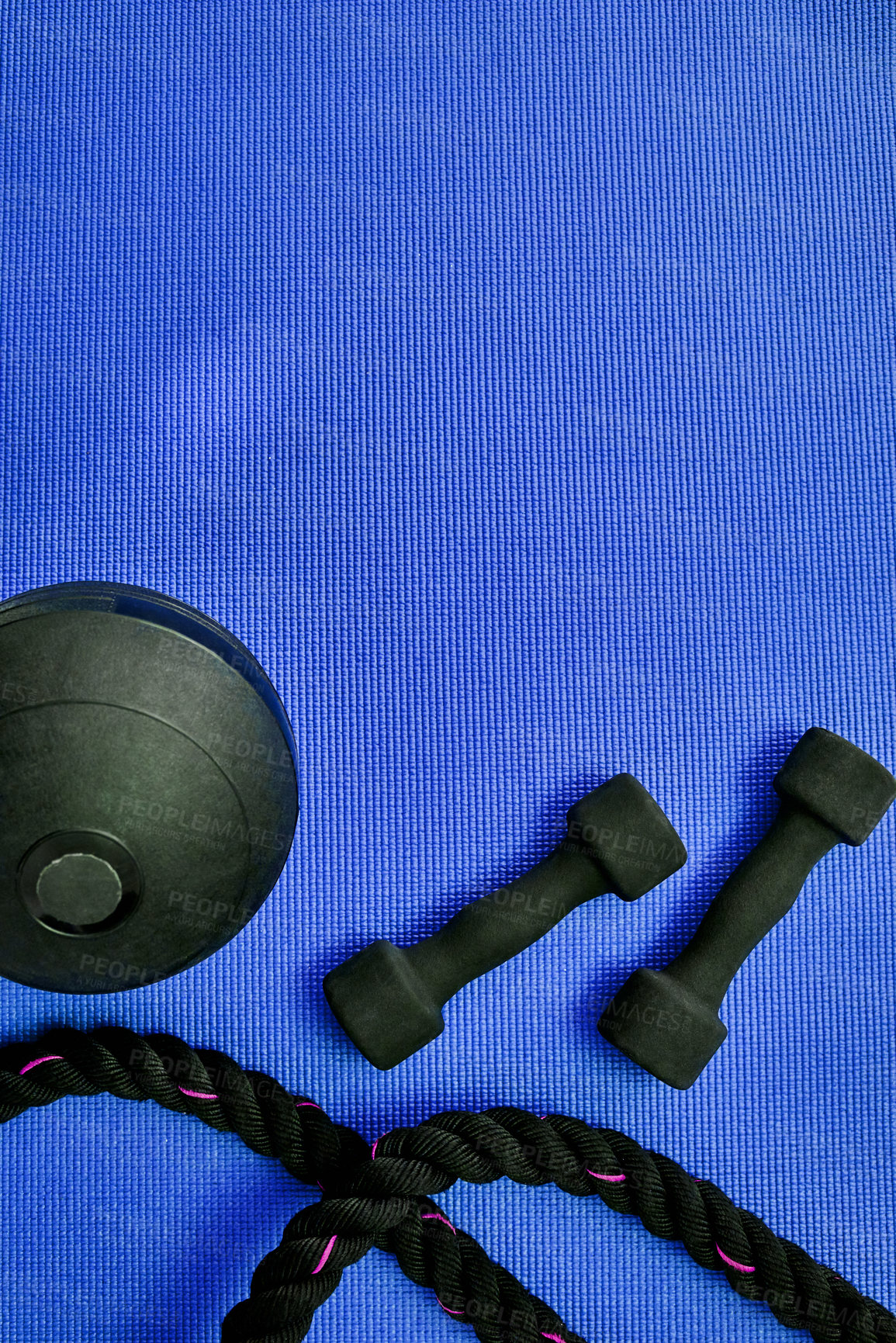 Buy stock photo Workout, equipment and fitness with dumbbell in studio for strength training, resistance and wellness. Top view, weights and blue background with rope for bodybuilding routine, health and endurance