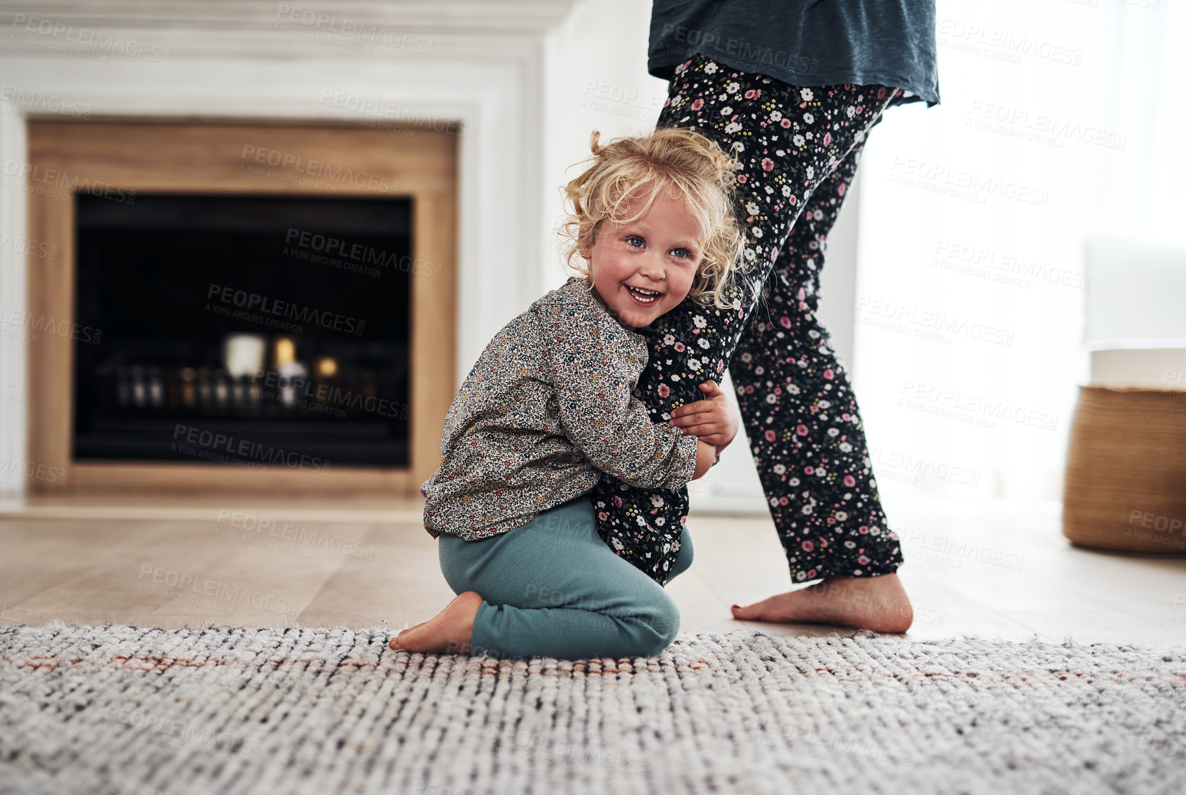 Buy stock photo Cropped shot of an adorable little girl bonding with her mother during a day at home