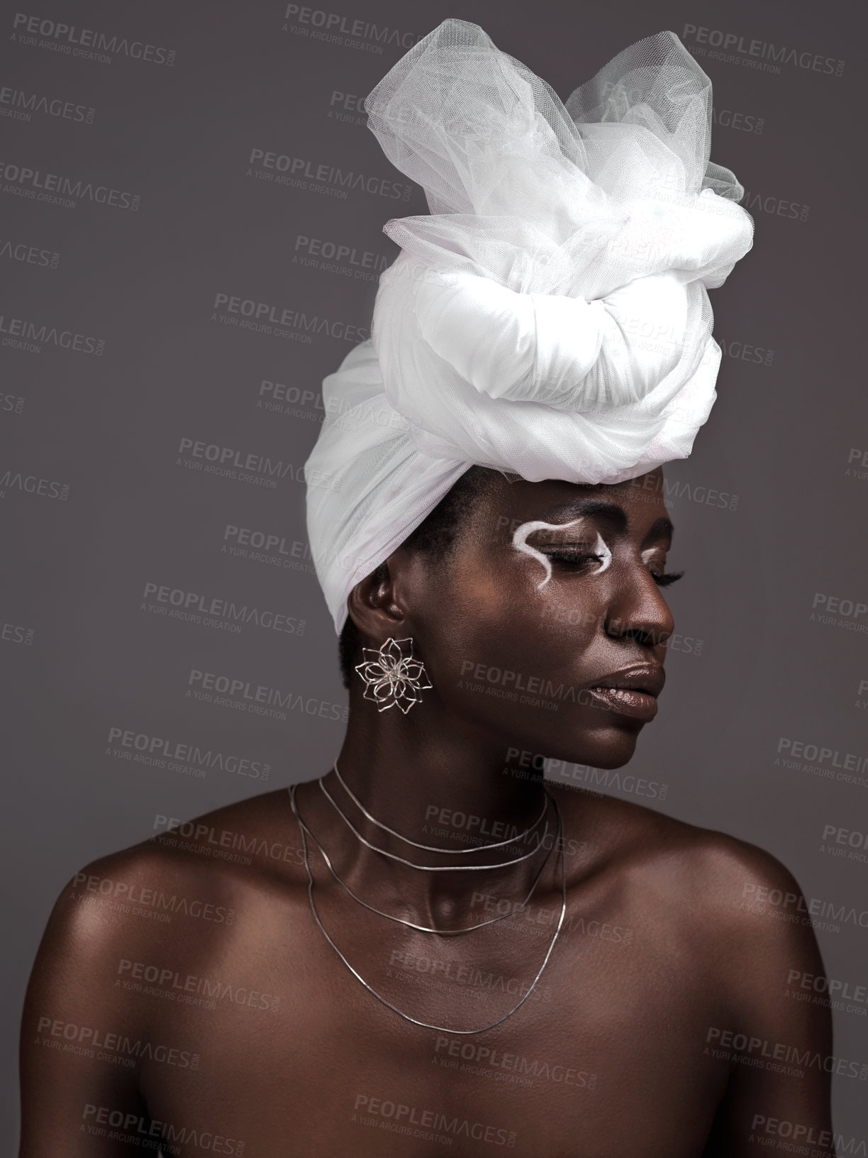 Buy stock photo Face, wrap and black woman with makeup, skincare or confidence in studio on grey background. Beauty, profile or proud African model with traditional culture, eyeshadow cosmetics or creative necklace 
