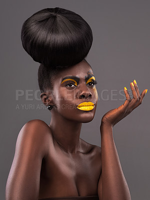 Buy stock photo African, person and studio face with makeup, beauty and creative yellow lipstick. Bold, woman and skin with confidence, dramatic hair and bun for glamour and trendy cosmetics on grey background