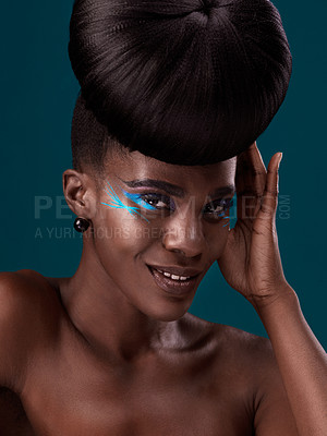 Buy stock photo Portrait, makeup and happy with an african woman in studio on a blue background for hair or cosmetics. Eyeshadow, smile and fashion with an attractive young female model at the salon for style
