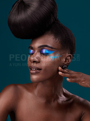 Buy stock photo Face, makeup and hair with an african woman model in studio on a blue background for cosmetics or haircare. Beauty, eyeshadow and haircare with an attractive young female person posing eyes closed