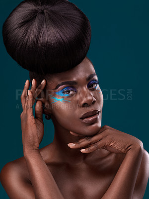 Buy stock photo Portrait, hair and cosmetics with an african woman in studio on a blue background for beauty or makeup. Eyeshadow, haircare and fashion with an attractive young female model at the salon for style
