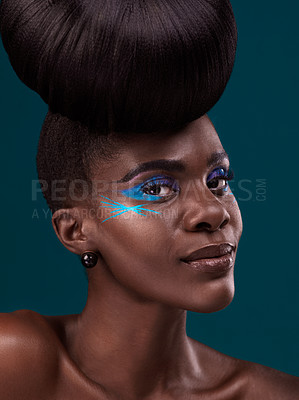 Buy stock photo Portrait, haircare and makeup with a model black woman in studio on a blue background for beauty. Face, hair and cosmetics with an attractive young female person at the salon for fashion or styling