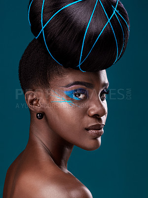 Buy stock photo Portrait, hair and makeup with a serious black woman in studio on a blue background for beauty. Face, haircare and cosmetics with an attractive young female model at the salon for fashion or styling