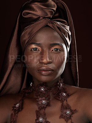 Buy stock photo Black woman, wrap and portrait in studio for confidence, natural beauty and makeup on dark background. Cosmetics, African fashion and female model with traditional head scarf, accessories or glamour