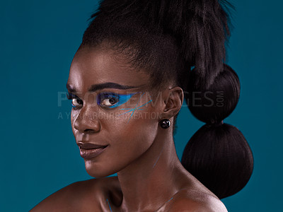Buy stock photo Portrait, hair and makeup with an african woman in studio on a blue background for beauty or cosmetics. Face, haircare and fashion with an attractive young female model posing for natural style